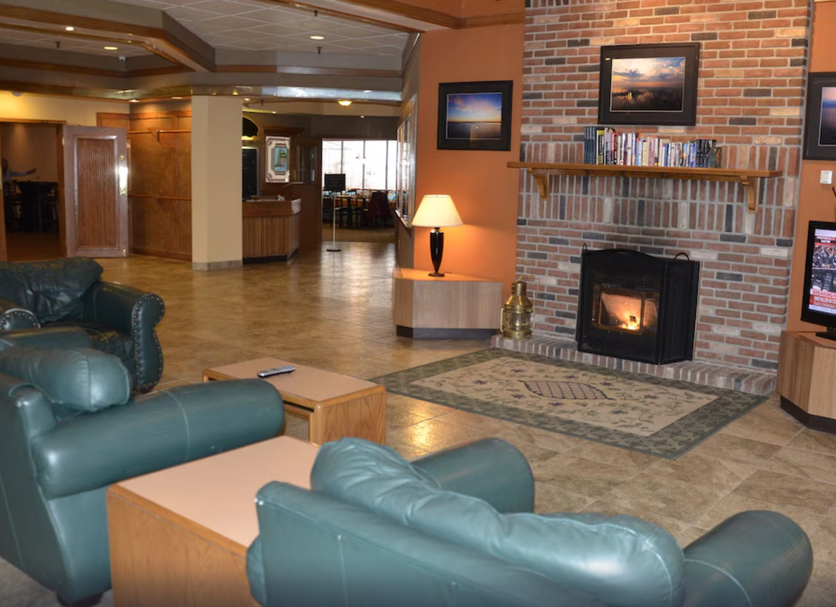 Tawas Bay Beach Resort in East Tawas lobby with fireplace and leather seating