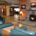 Tawas Bay Beach Resort in East Tawas lobby with fireplace and leather seating