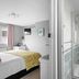 Sandway House, Torquay: bedroom with adjoining tiled shower room and glass-enclosed shower
