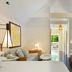 Winslow's Bungalows in Key West guest room with vaulted ceiling, sitting area, and view to a balcony.