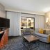 Courtyard by Marriott Dallas-Fort Worth/Bedford room with sofa, chairs and patio view in Bedford