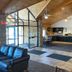Motel 6 Norway MI lobby with vaulted wood ceiling, staircase and seating area in Norway