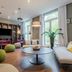 Citadines Arnulfpark Munich lounge in Munich with colorful seating, large windows, and a central coffee table