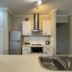 Cairns Beach Resort Holloways Beach kitchen with stainless steel appliances and countertop sink