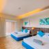 Brisa Marina Beach Resort powered by Cocotel in Morong guest room with two beds and windows