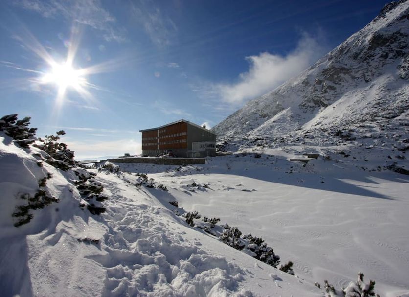 Horsky Hotel Sliezsky Dom in Vysoké Tatry beside a snow-covered mountain landscape