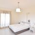 Erato Hotel in Agia Marina guest room with double bed, bedside lamps, and ensuite bathroom