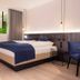 Langwies Genussherberge Vigaun guest room with king bed, blue accents and hanging pendant lights