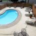 Express Inn & Suites San Antonio Near Sea World Medical Center pool with loungers and patio