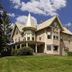 Margaretville Mountain Inn B&B in Margaretville, Victorian inn on a grassy hill under a blue sky