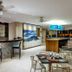 Blu Hotel by Tamaca in Santa Marta: hotel bar and lounge with seating, mosaic counter, and ocean mural