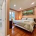 Cozy Home Near Transit & Hillcrest Mall in Richmond Hill bedroom with ensuite bathroom and hardwood floors