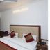 Vishal Hotel Near New Delhi Railway Station room with bed, mirrored wardrobe, and ceiling fan in New Delhi