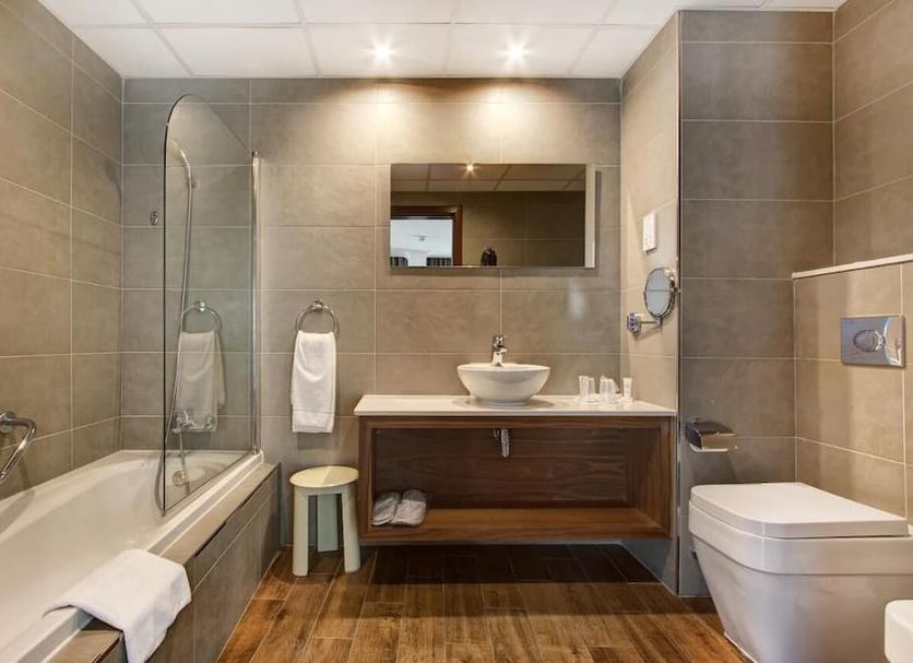Vivaldi Hotel, St. Julian's bathroom with bathtub, walk-in shower, vanity and toilet