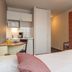 Appart'City La Rochelle studio room with kitchenette, bed, wardrobe and desk in La Rochelle