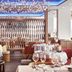 Myconian Korali Relais & Chateaux, Mykonos: elegant hotel restaurant with set tables and chandeliers