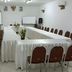 Seulawah Resort And Cafe in Batu meeting room with U-shaped table, chairs, and presentation screens