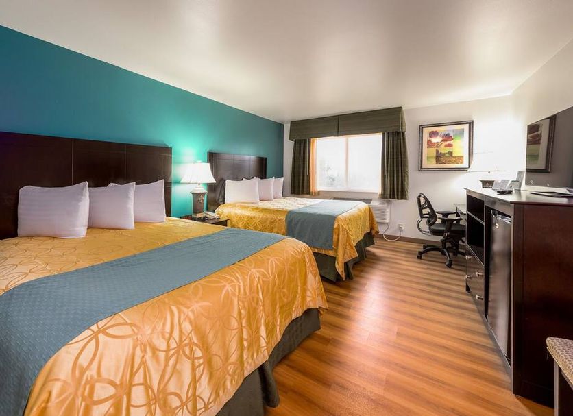 Sunset Motel Hood River guest room with two beds, desk, and window view in Hood River