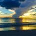 Carousel Suites -Redington Shores beach sunset with ocean view and a wading bird in the foreground