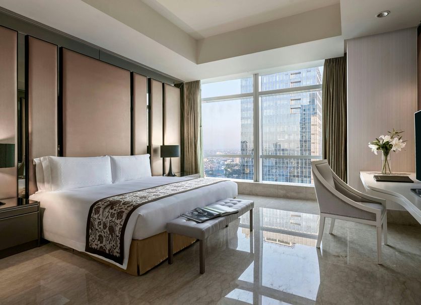 The Residences at The Ritz-Carlton Jakarta, Pacific Place room with city view, bed, desk and chair