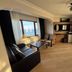 Amasra Ceylin Otel room with sea view, sofa, chairs, coffee table and TV in Amasra