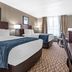Comfort Inn & Suites Glen Mills - West Chester guest room with two beds, desk, and TV