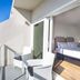 The Avalon Club in Clearwater Beach balcony with ocean view and open sliding doors to a bedroom