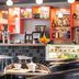 Hôtel Mercure Marne-la-Vallée Bussy-Saint-Georges bar with illuminated shelves, coffee counter and seating