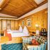 Schloss Hotel Holzrichter in Nachrodt-Wiblingwerde: wood-paneled hotel room with twin beds and seating area