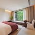Terra Art Sky Garden Boutique Hotel Chengdu guest room with large window and seating area