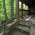 Cumberland Falls State Resort Park in Corbin, stone steps leading to a covered porch in the woods