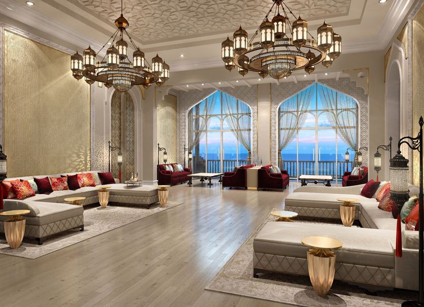 Hilton Salwa Beach Resort & Villas in Doha lounge with chandeliers and ocean-view arched windows