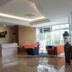Grand Orchid Hotel Yogyakarta lobby in Depok with front desk, seating area, and modern ceiling lights