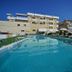 Park Hotel Serena in Rimini with outdoor pool, sun loungers and hotel building under clear blue sky