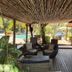 Pousada Morro dos Navegantes in Ilhéus, shaded outdoor lounge beside a pool