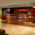 Courtyard by Marriott Nashville Brentwood lobby with front desk, seating area and warm wood accents