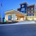 Homewood Suites by Hilton Salt Lake City Airport exterior at dusk in Salt Lake City with covered entrance