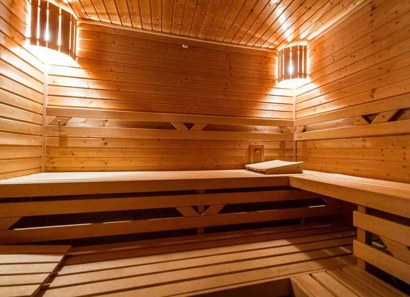 Lh Hotel Medinek Old Town in Kutná Hora sauna with wooden benches and warm lighting