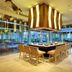Grand Palladium Kantenah Resort & Spa in Akumal dining area with a central table and open garden views