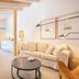 Sa Rota d'en Palerm in Lloret de Vistalegre: bright suite with sofa, round table and countryside view