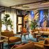 Quality Hotel The Reef in Frederikshavn lounge with tropical mural, plants, and colorful seating