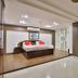 OYO 2494 Hotel Shree Plaza in Bharuch guest room with king bed and modern open-plan layout