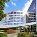 ibis Melbourne Glen Waverley exterior with curved glass facade and landscaped entrance