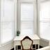 Shadowcrest in Fleischmanns: bright bay window nook with white desk and upholstered chair