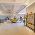 Pace Hotel Suzhou Renmin Road lobby with a large gold reception desk and modern seating in Suzhou