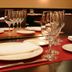 Hotel La Boroña Gijón restaurant table set with wine glasses, plates, and folded napkins
