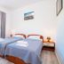 Apartments Azzurro, Dubrovnik: twin bedroom with two single beds, bedside lamps, and a window with shutters
