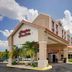 Hampton Inn & Suites Ft. Lauderdale Airport/South Cruise Port in Hollywood exterior entrance with palm trees