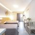 Oasis Tigaki in Tigaki, bright twin room with desk, balcony door and simple light wood furnishings