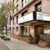 Night Hotel Broadway in New York, street view of entrance with marquee and lion statues